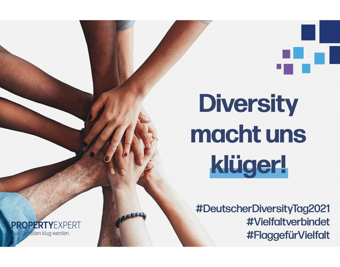 Hände übereinander gestapelt, daneben der Schriftzug „Diversity macht uns klüger!”